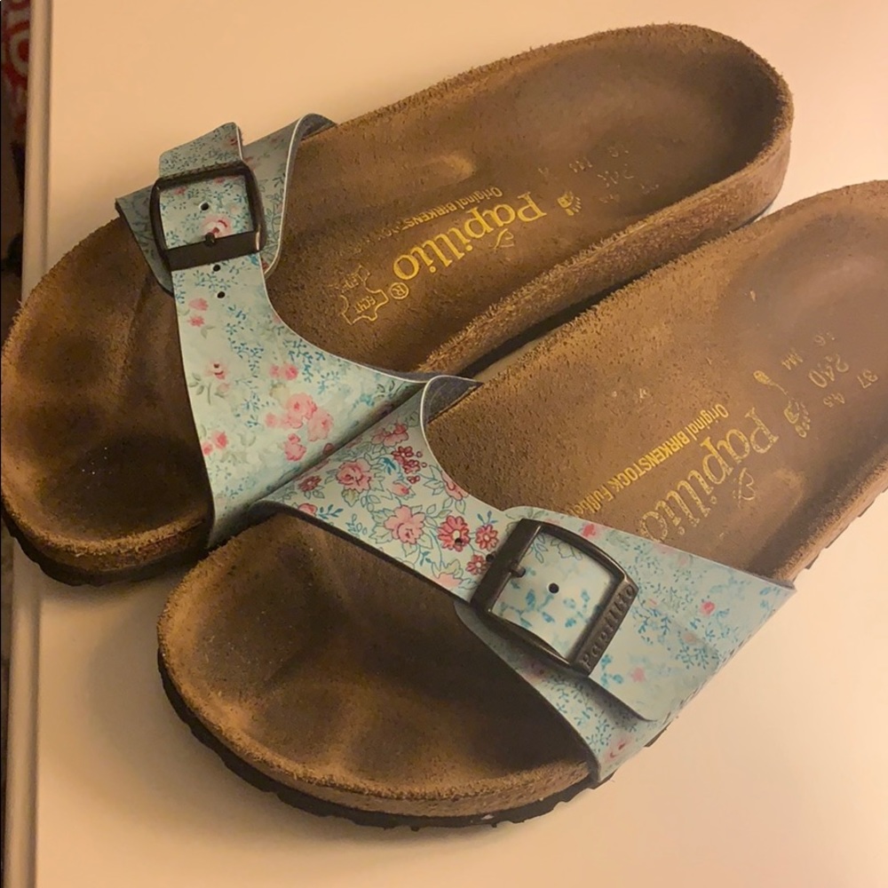 Blue floral Birkenstock sandals.